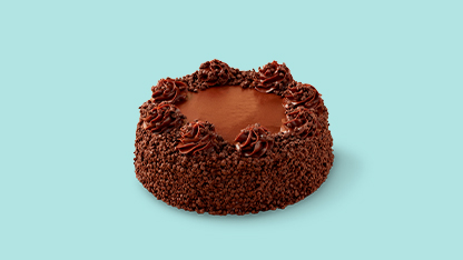 A delicious chocolate cake with chocolate crust and a heart-shaped hole in it.