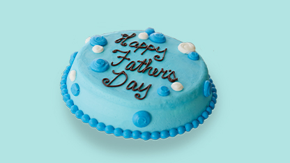 Blue and white birthday cake with father's day greeting.