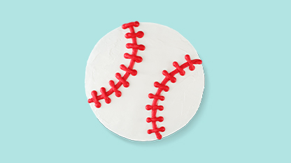 Baseball-themed cake on a blue background.